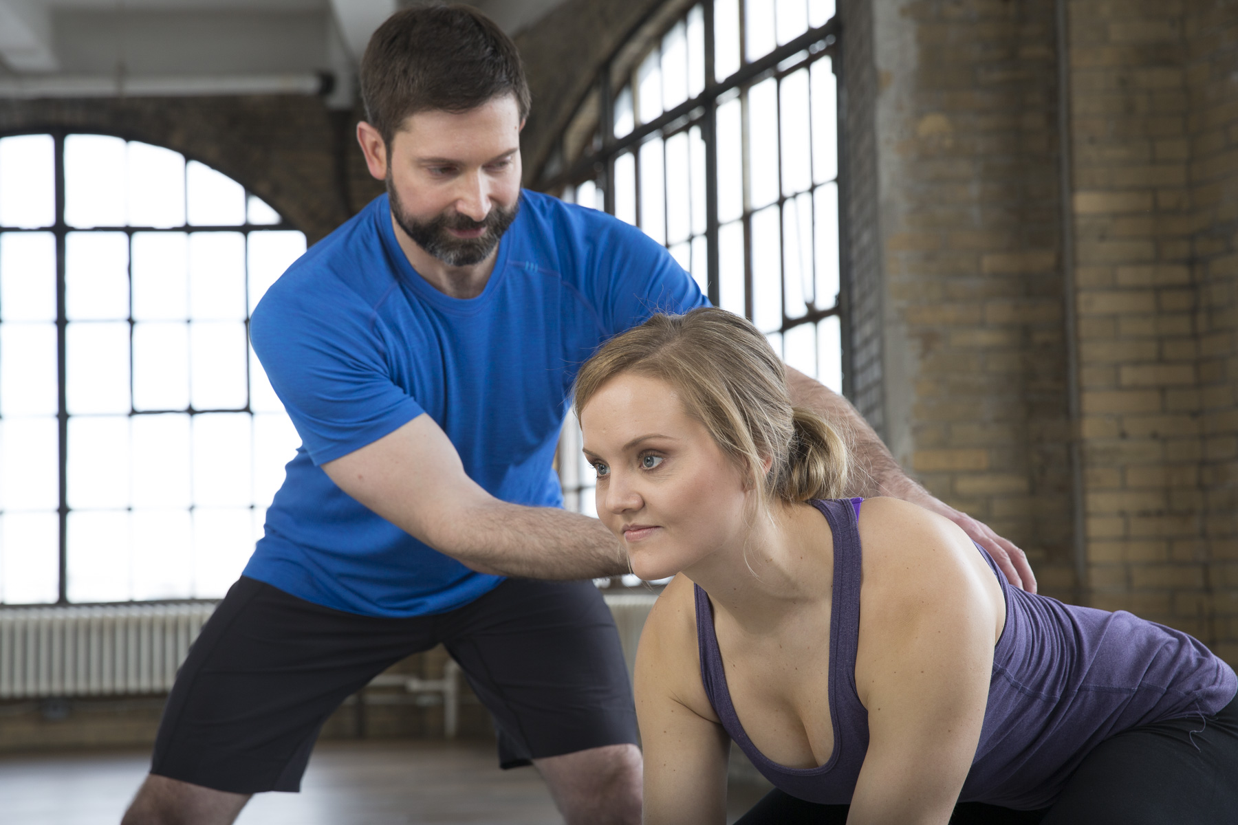 Matt Semrick coaching a client on proper form during a personal training session