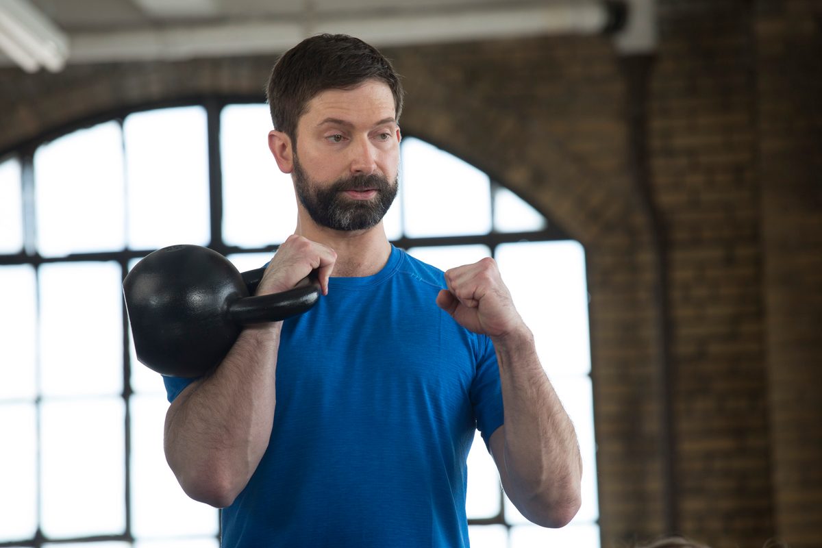 Matt Semrick, personal trainer in Louisville KY, holding a kettlebell